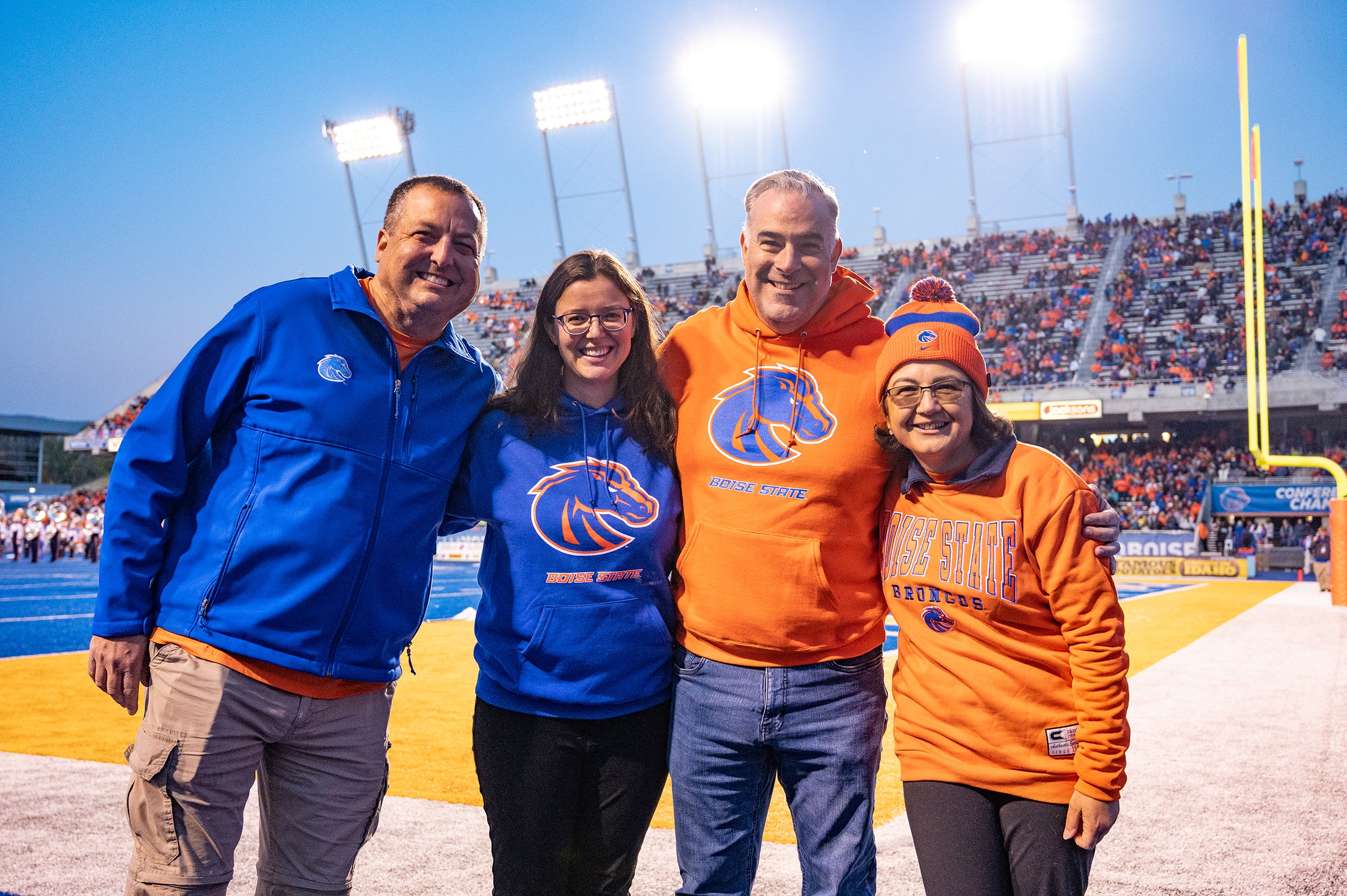 Members of Boise State faculty on the Blue Turf