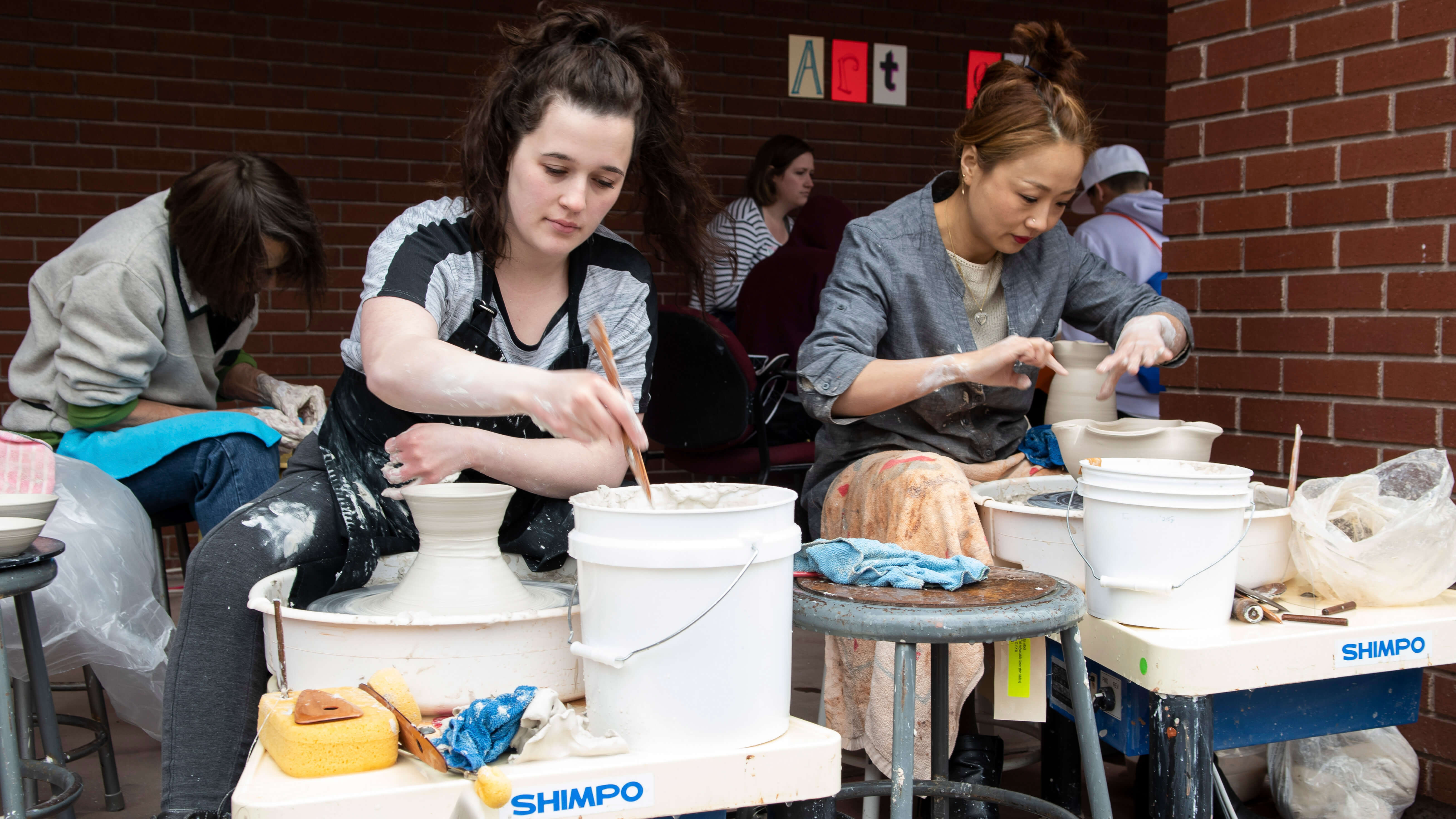 Ceramics students creating pottery