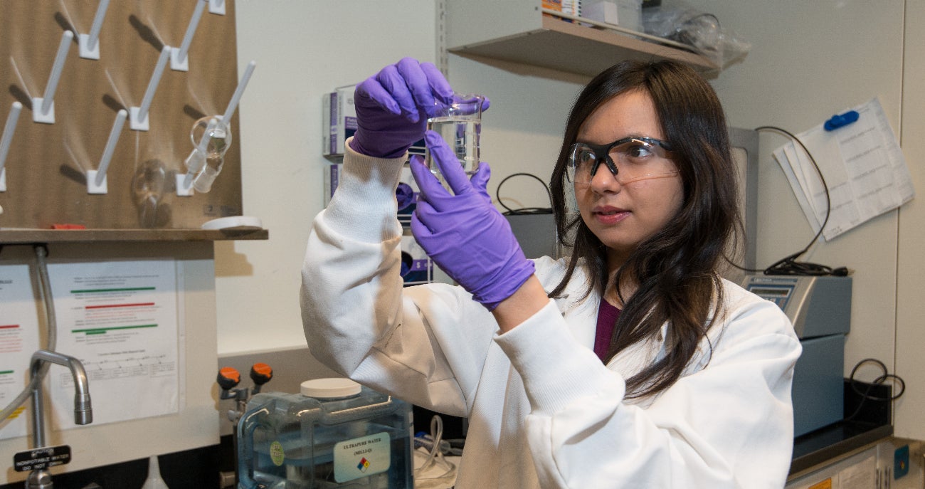 student researcher working in lab