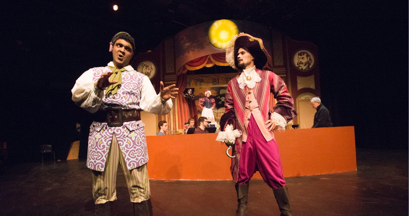 Students performing in Pirates of Penzance musical opera.
