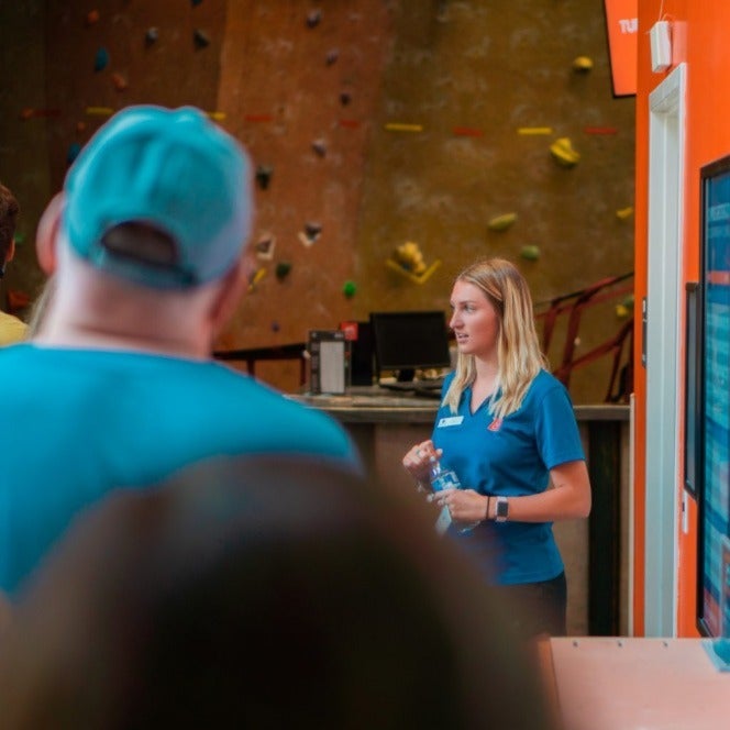 A tour guide shows visitors the Boise State Rec Center