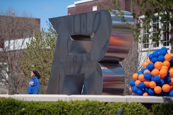B monument with blue and orange balloons