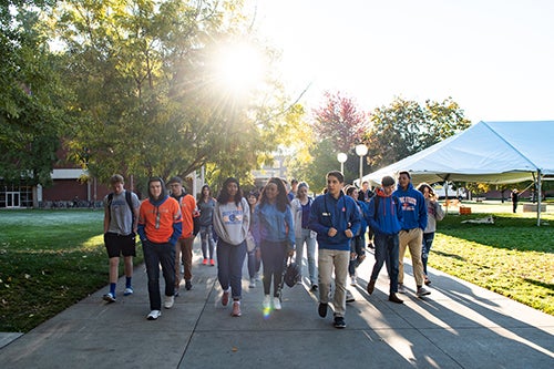 A tour guide leads prospective students around Boise State's campus