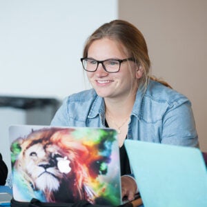 Boise State student visits with classmates