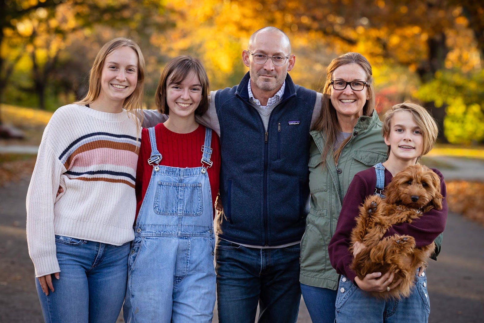 Left to right: Sydney, 20, a junior at the University of Kansas; Sophia, 18, a freshman at Flagler College; David, Sara, Austin, 13, a 7th grader; and Millstone, or “Millie,” a mini goldendoodle.