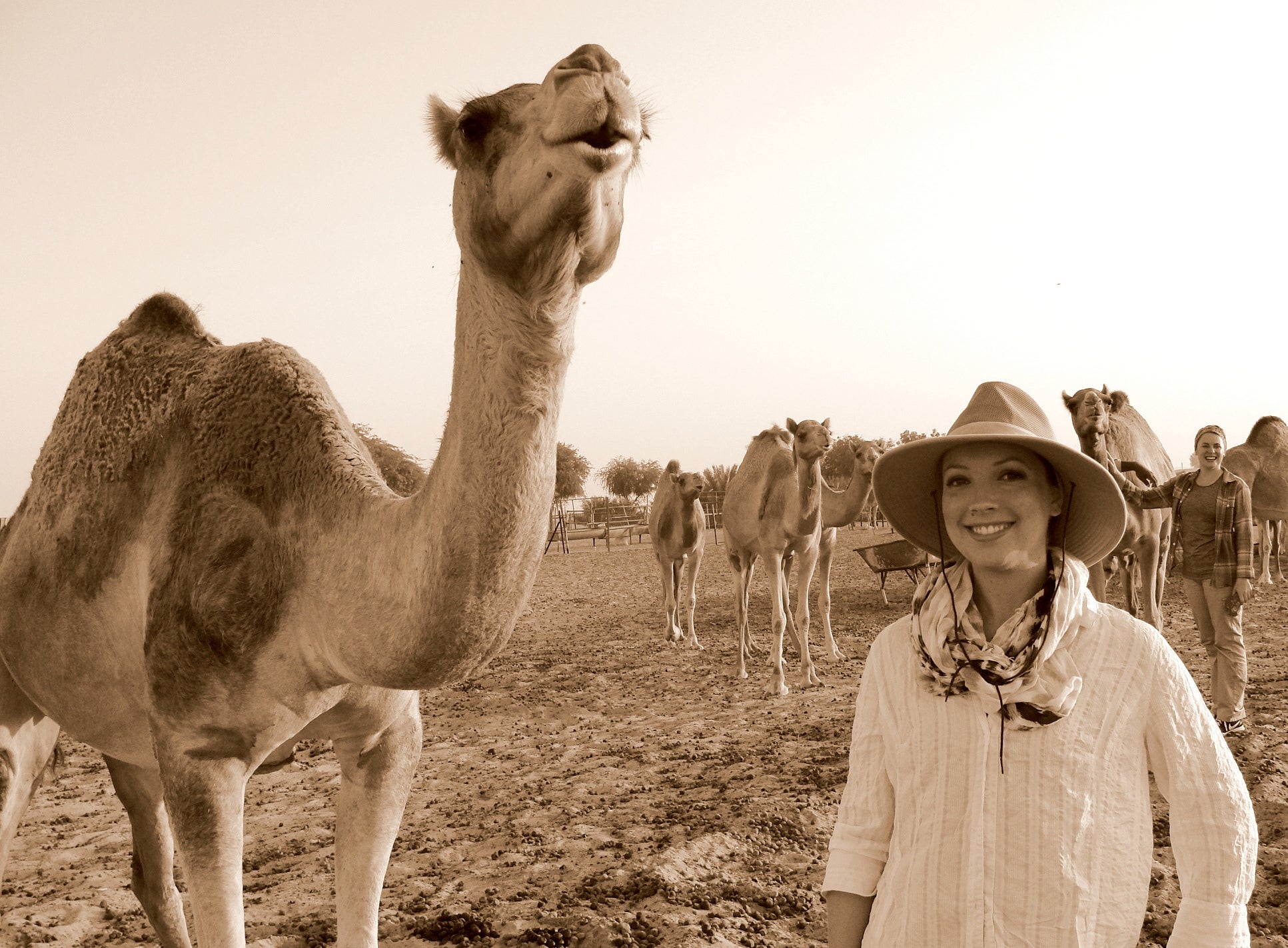 Student Margaret Amundson standing next to a camel