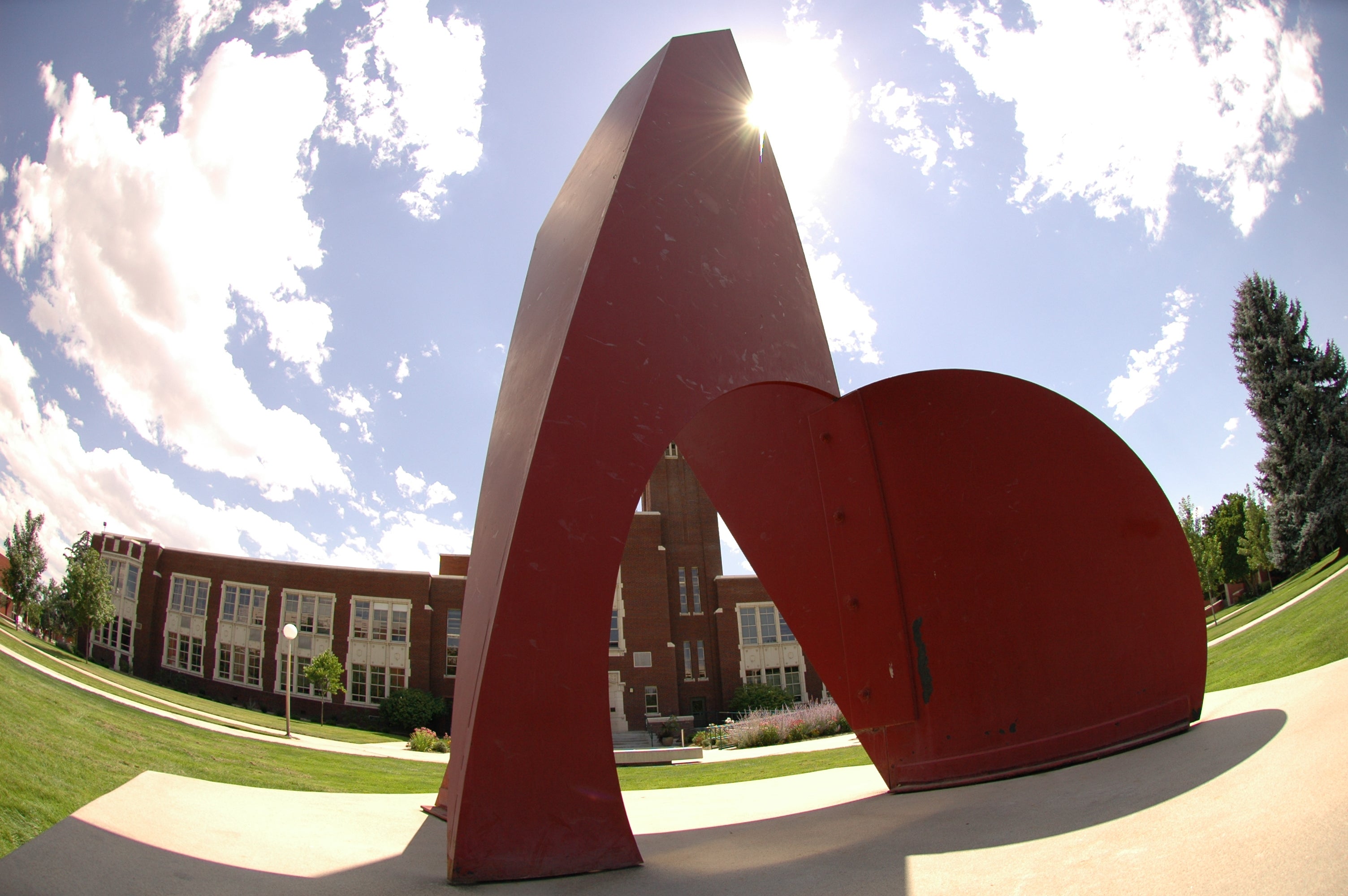 Large red steel sculpture on Boise State's quad