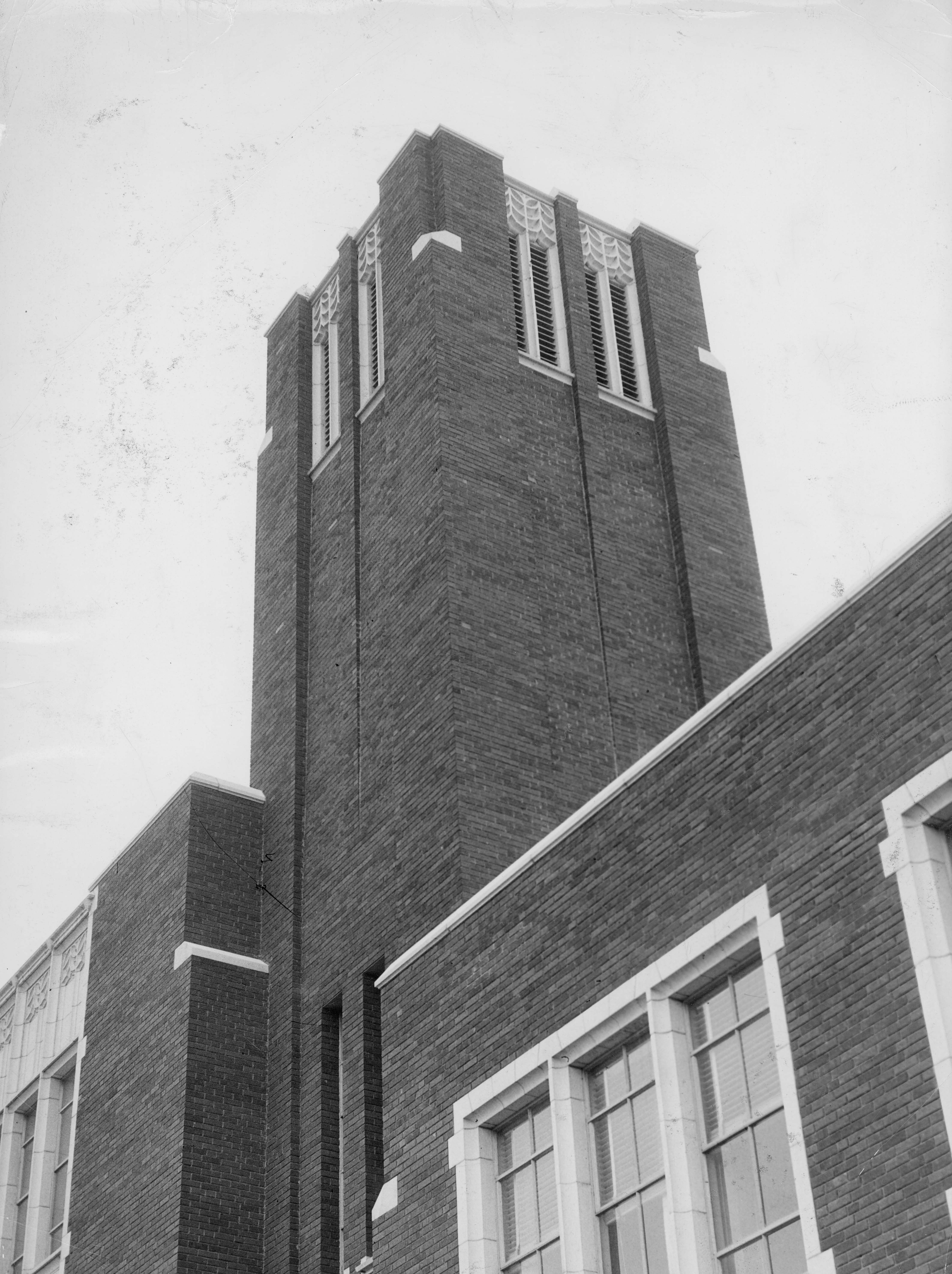 Black and white photo of brick tower containing Boise State's carillon bells