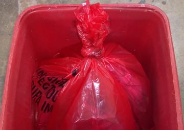 photo showing regulated medical waste disposal bag with a balloon style knot