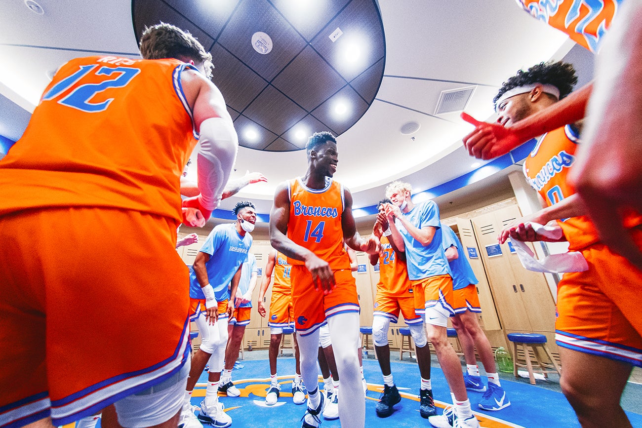 Basketball players celebrating in locker room