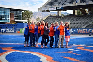 Some of the Career Center staff posing on the blue turf
