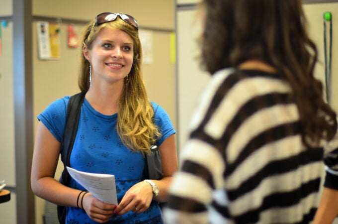 Two female students talking.