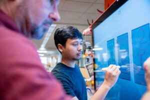 Student using a digital screens to concept his ideas. 