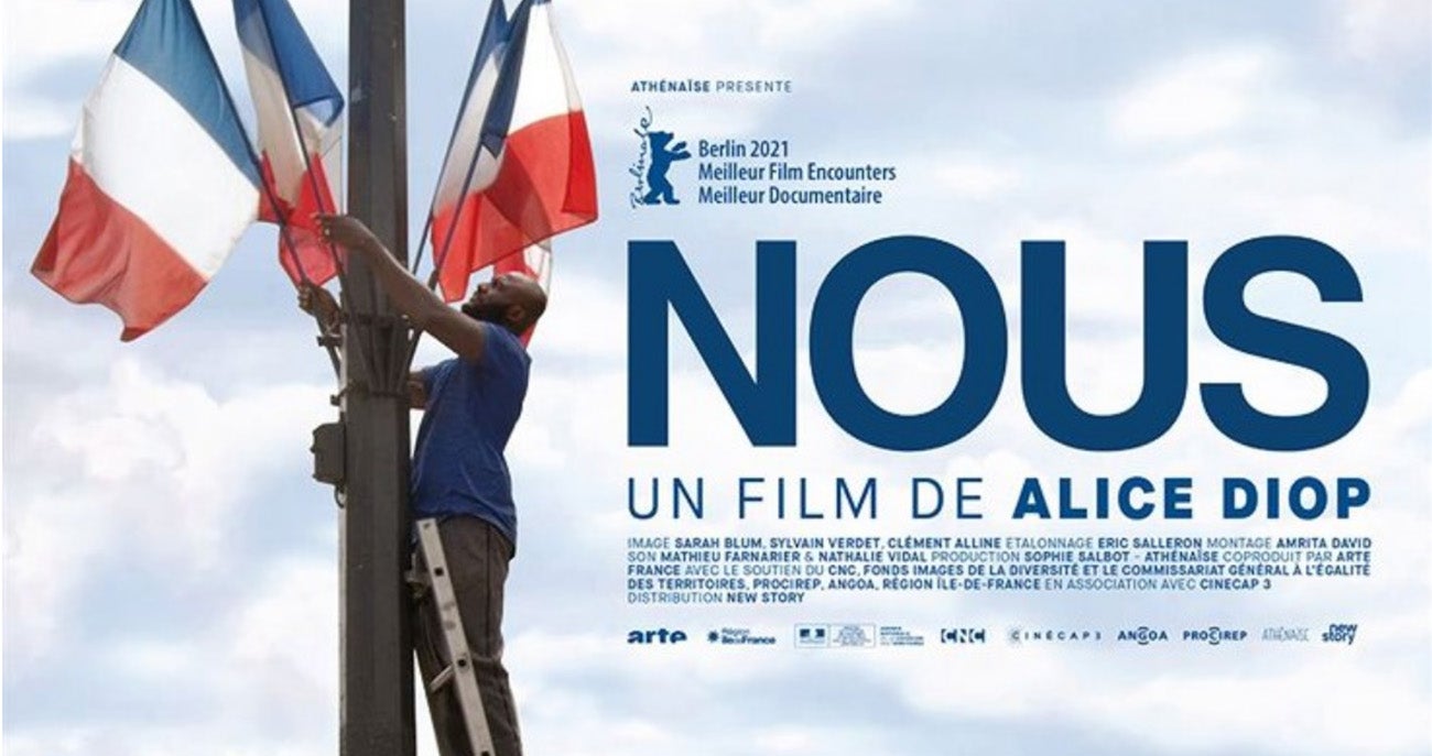 Poster for Diop's documentary "Nous" showing a man on a ladder installing French flags on a pole
