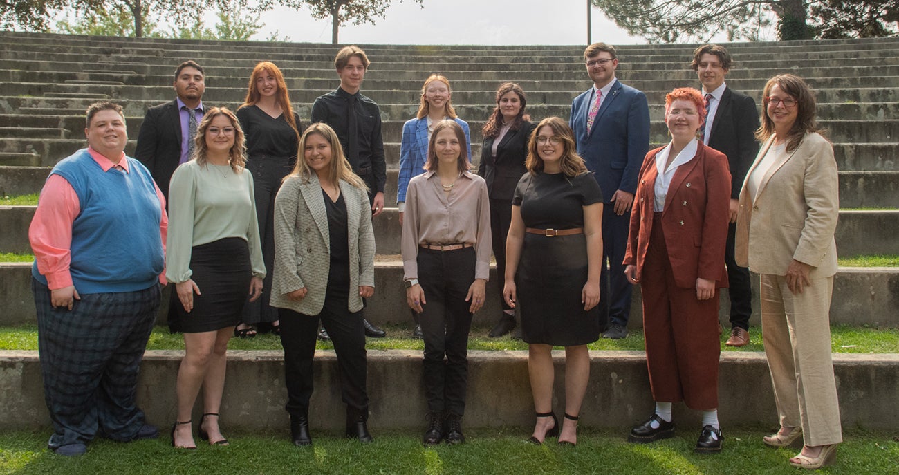 The 2022-2023 Talkin' Broncos Speech and Debate Team from Boise State standing in the amphitheater.