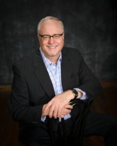 Man with Glasses in black suit