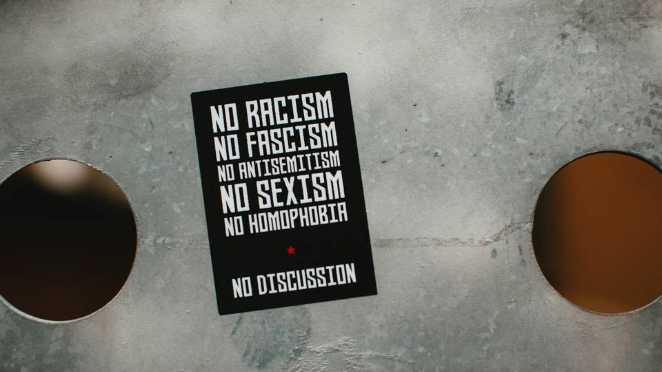 No racism no fascism sticker on a metal plate