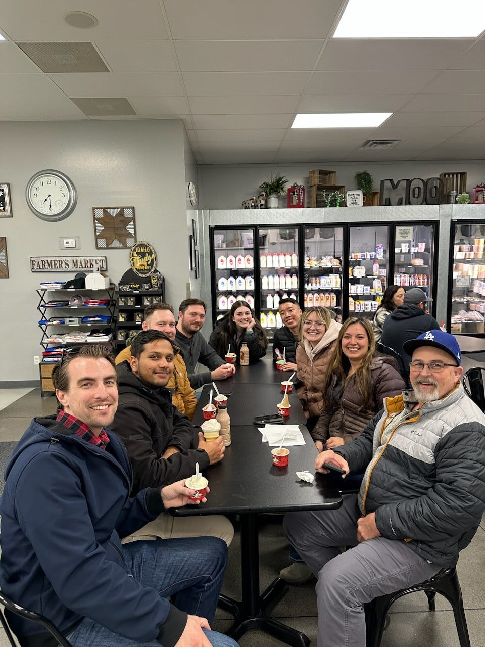 group of students from Advanced Materials Laboratory sitting at a table eating ice cream