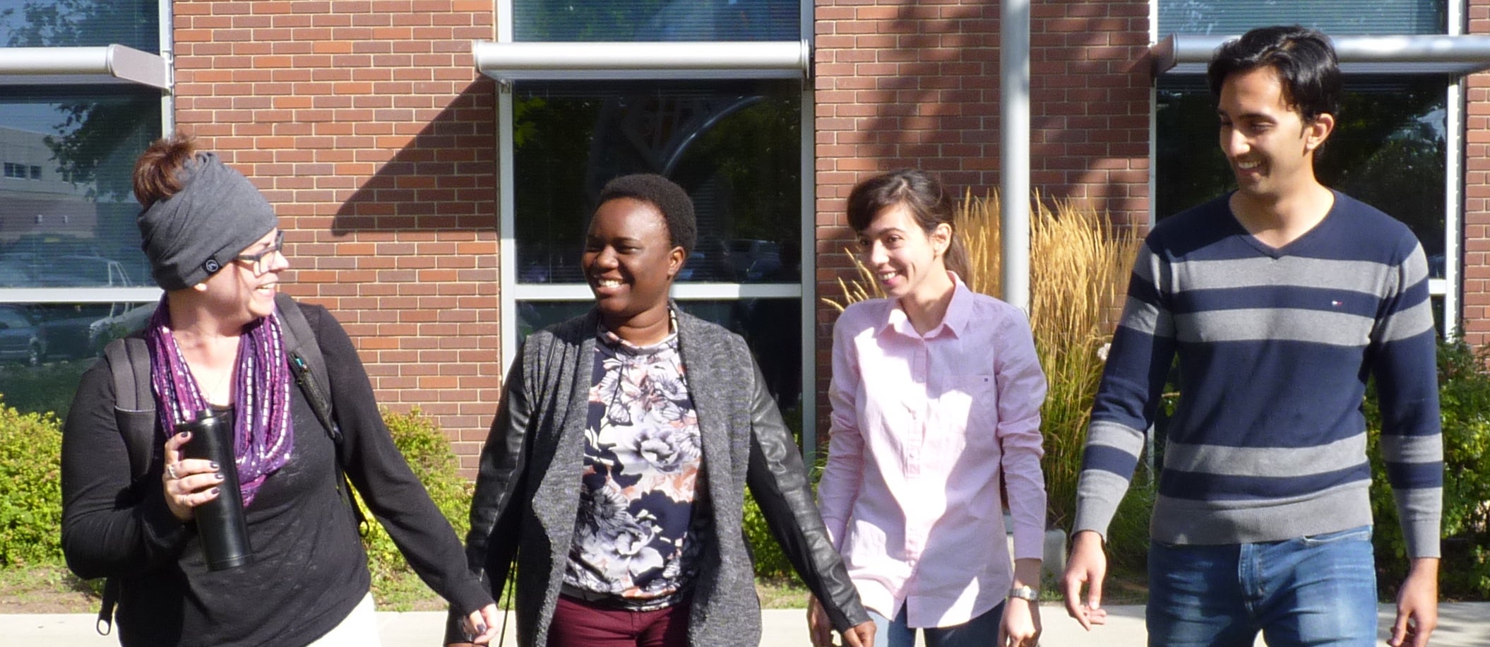 Group of students walking on campus, photo