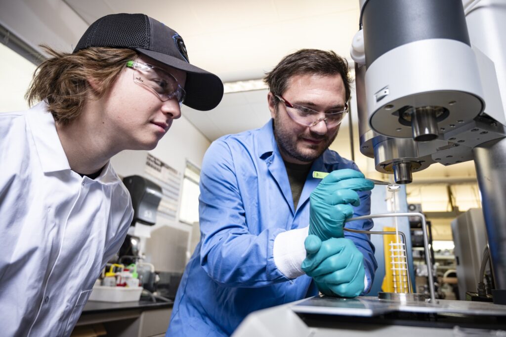 researchers performing research in lab