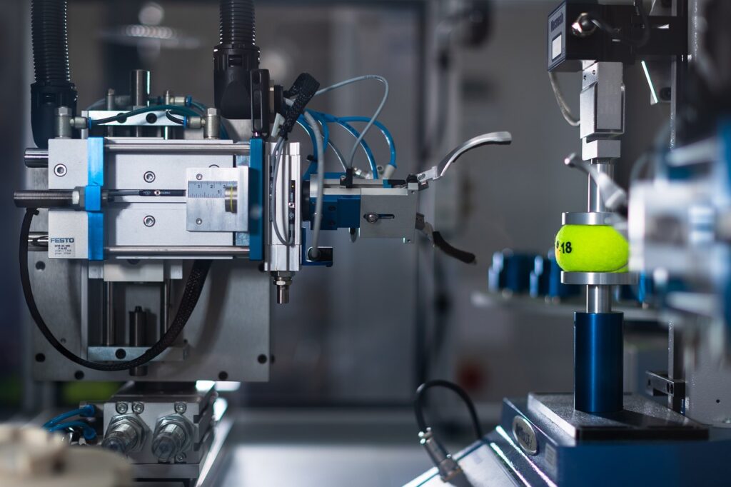 lab equipment testing pressure on a tennis ball