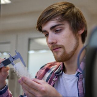 student taking measurements