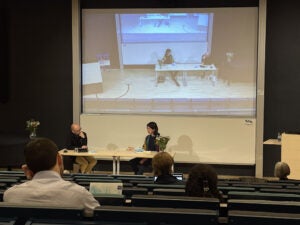 two people having a discussion at a table