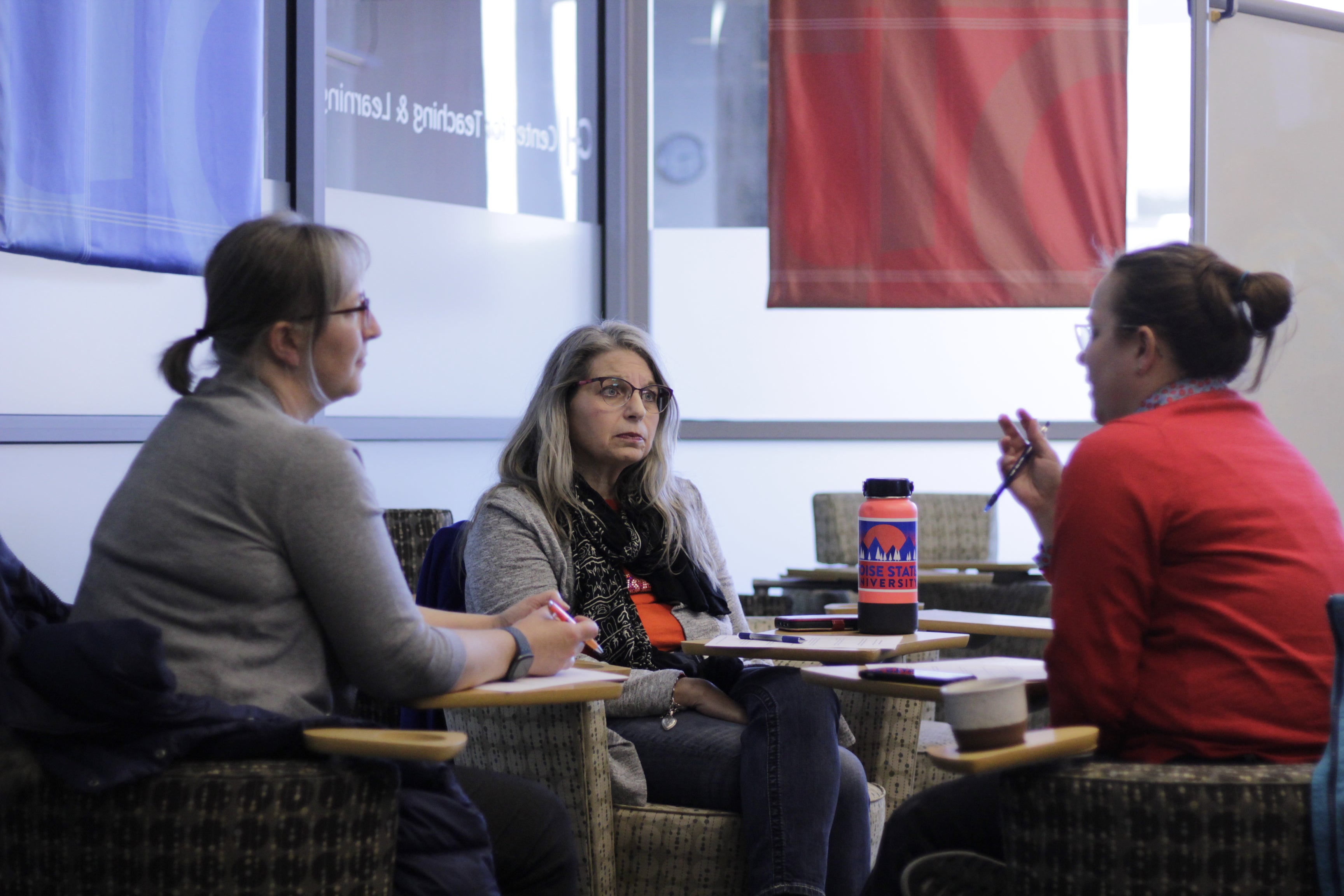 Three faculty members discuss workshop topic