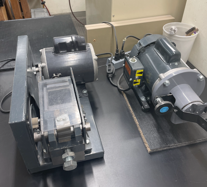 Miniature jaw crusher and disk mills with alumina ceramic and tungsten carbide face plates for small scale sample preparation.