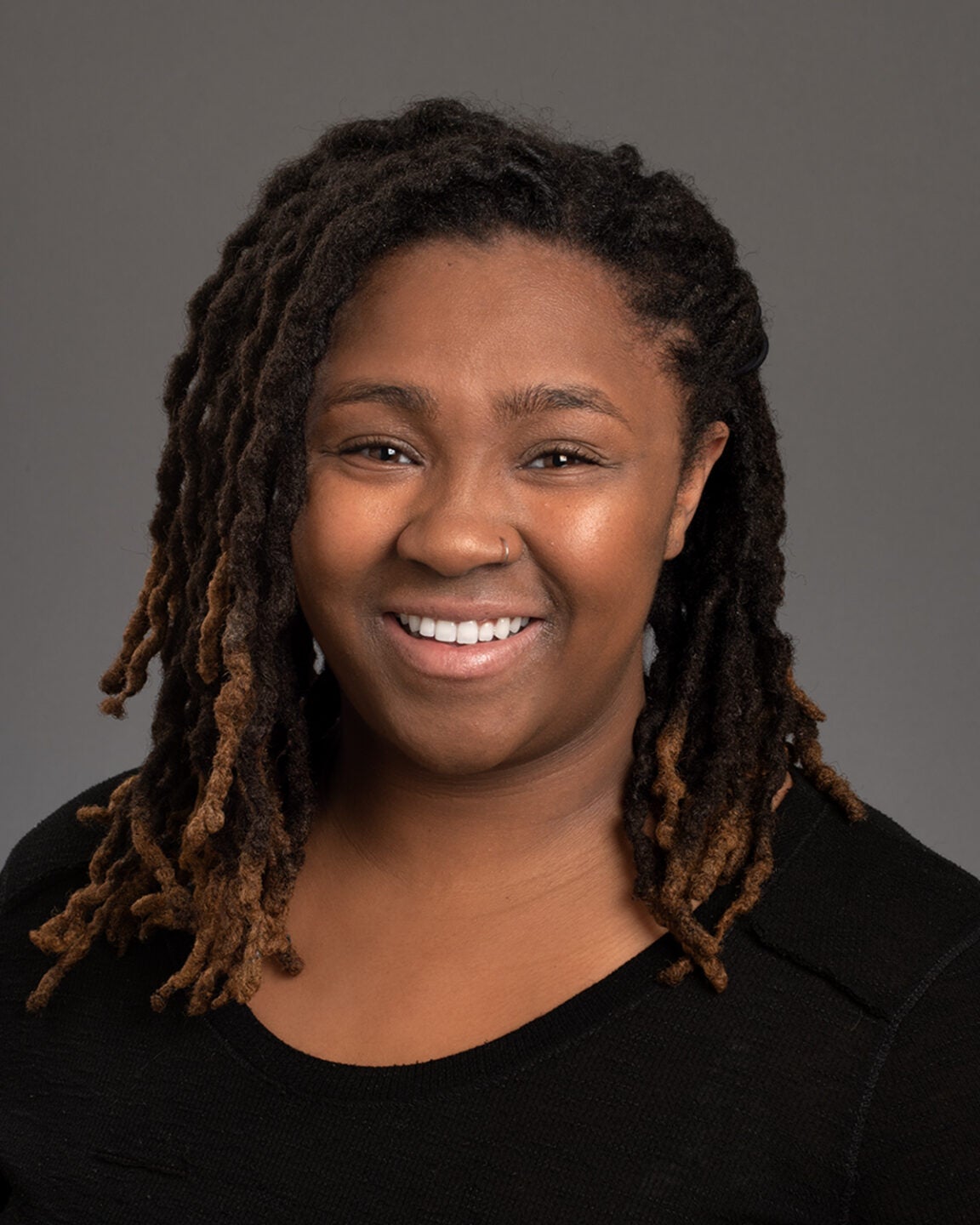 Professional headshot of McNair Scholar Tionna Gardner