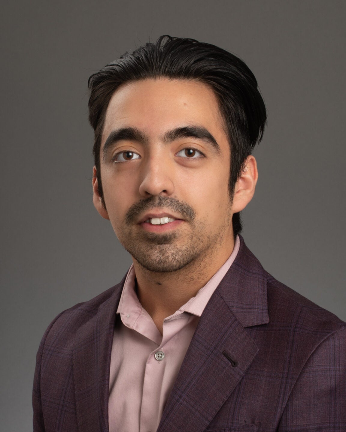 Professional headshot of McNair Scholar Kyle Holloway