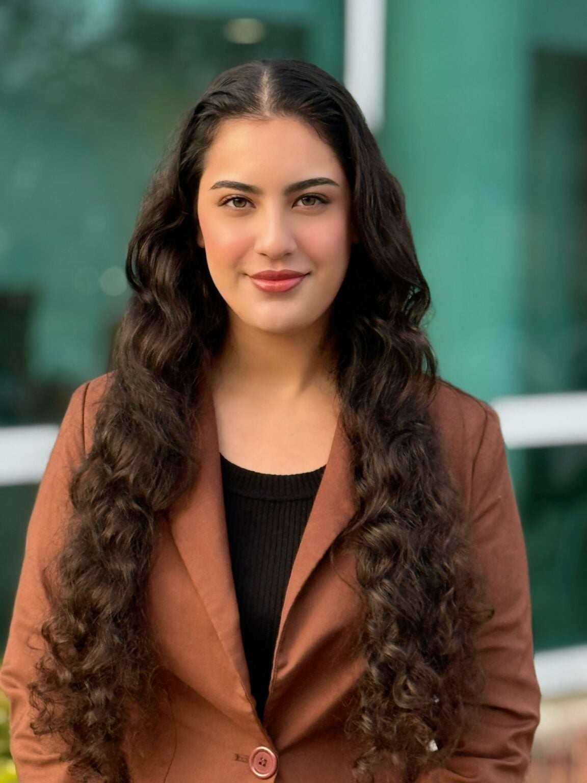 Professional headshot of Roz Al Janabi