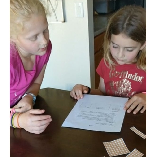Kids playing math game at table