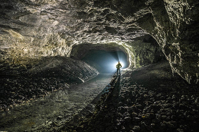 Person standing in underground cave