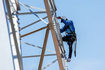 worker on guy tower