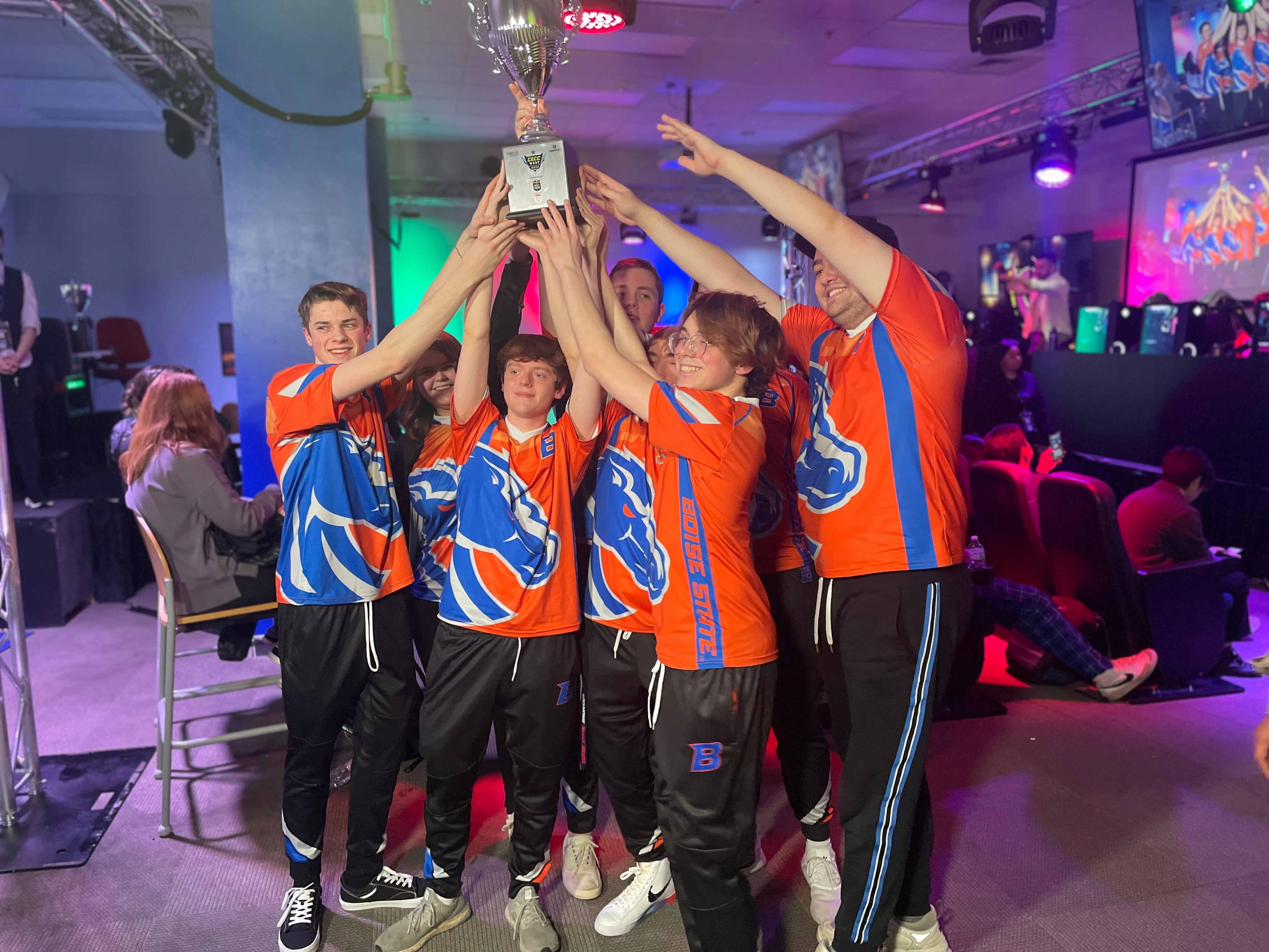 Boise State Overwatch players hold up the trophy for the CECC West Regionals.