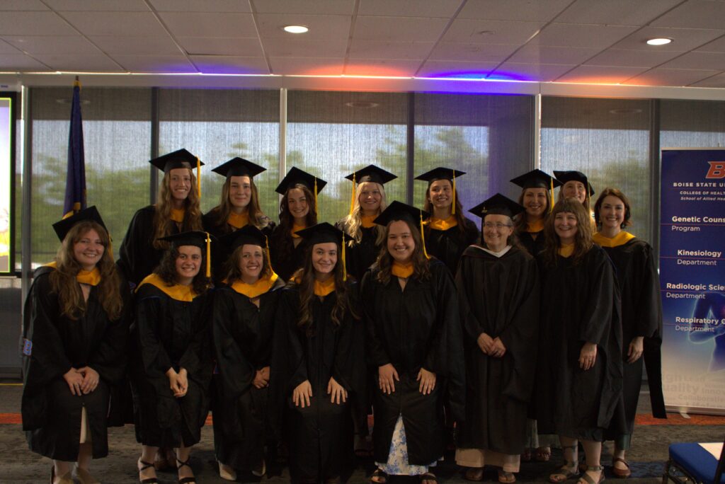 Graduates pose for a group photo.