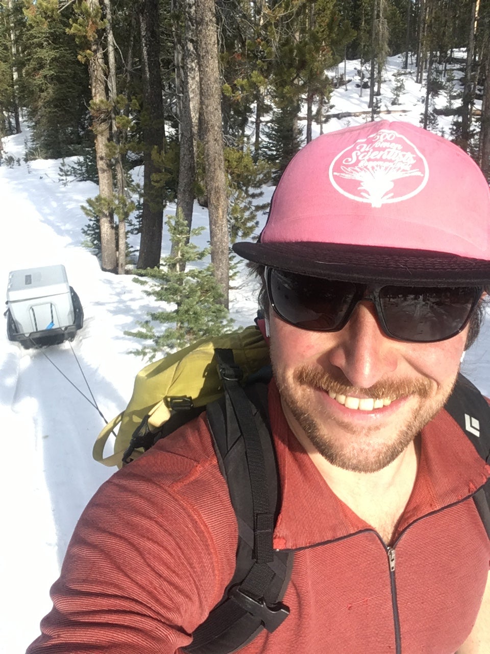 ach Keskinen, doctoral student in geophysics works with radar and infrasound to study snowpack and avalanche physics. Zach, seen here transporting car batteries to his field site, is advised by HP Marshall and Jeffrey Johnson.
