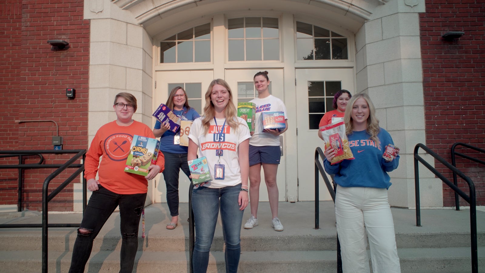 students in front of the campus food pantry
