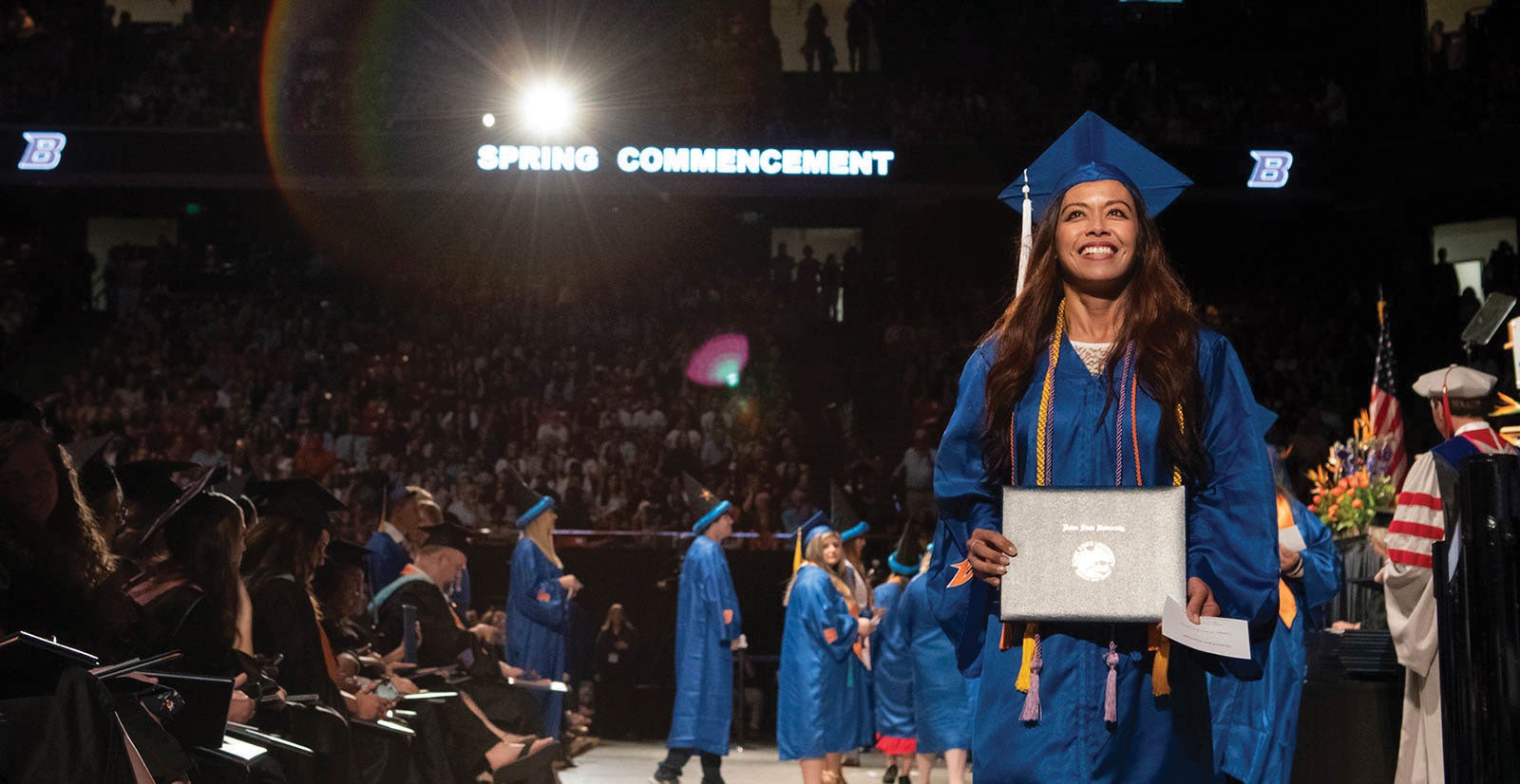 boise state graduate with diploma at commencement