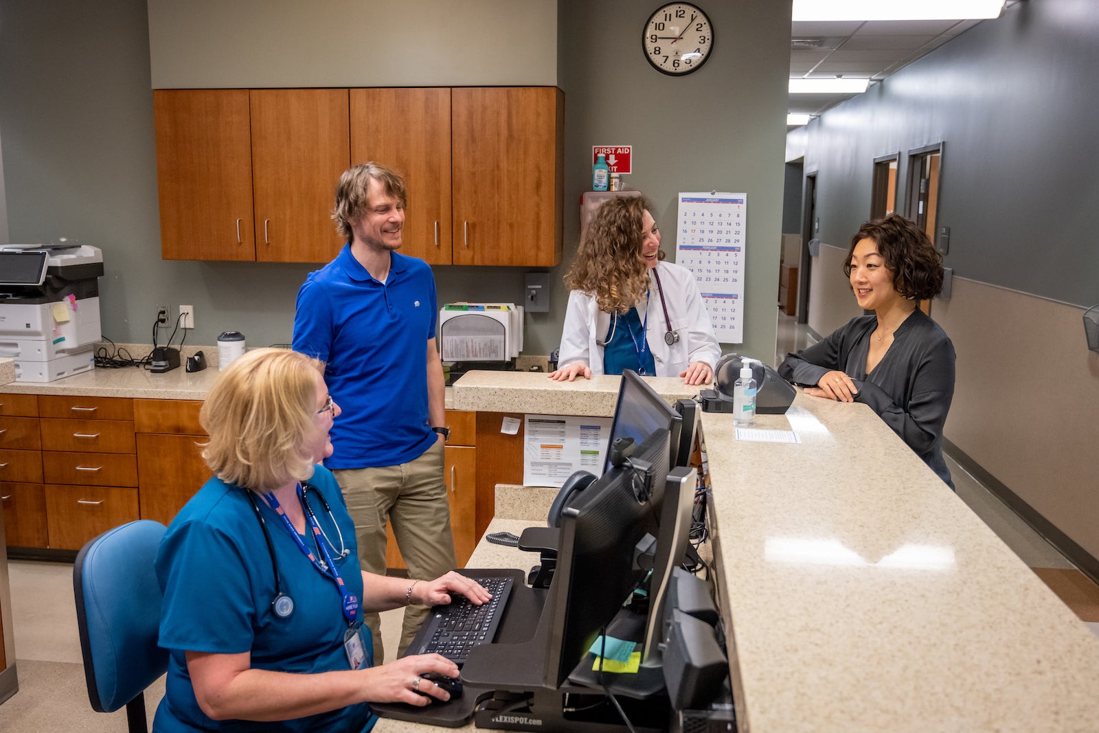 Health Services staff consult across disciplines. Left to right: Tracy Tew, licensed practical nurse; Brian Davies, counselor and group counseling coordinator; Heather Wilcke, nurse practitioner; and Ayako Otani, counselor and clinical coordinator.