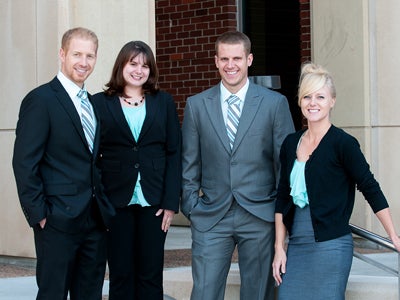 Group of students wearing suits