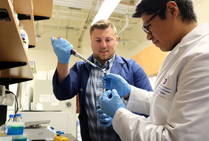 Two student researchers