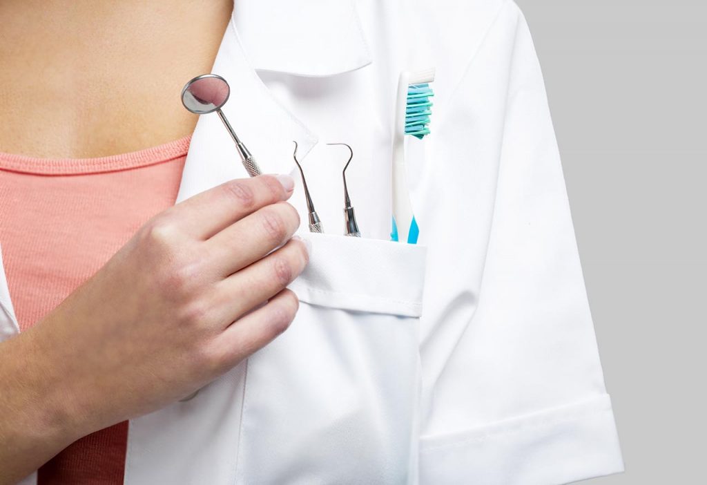 dental person holding tools