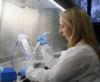 Photo of Morgan Hansen working in lab