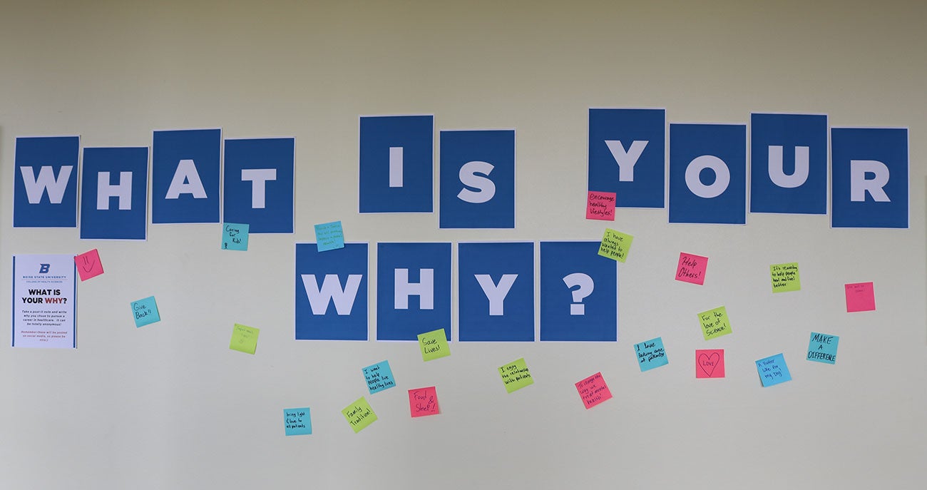 Photo of sign "What is your why?" and post-it note responses from College of Health Sciences faculty, staff and students