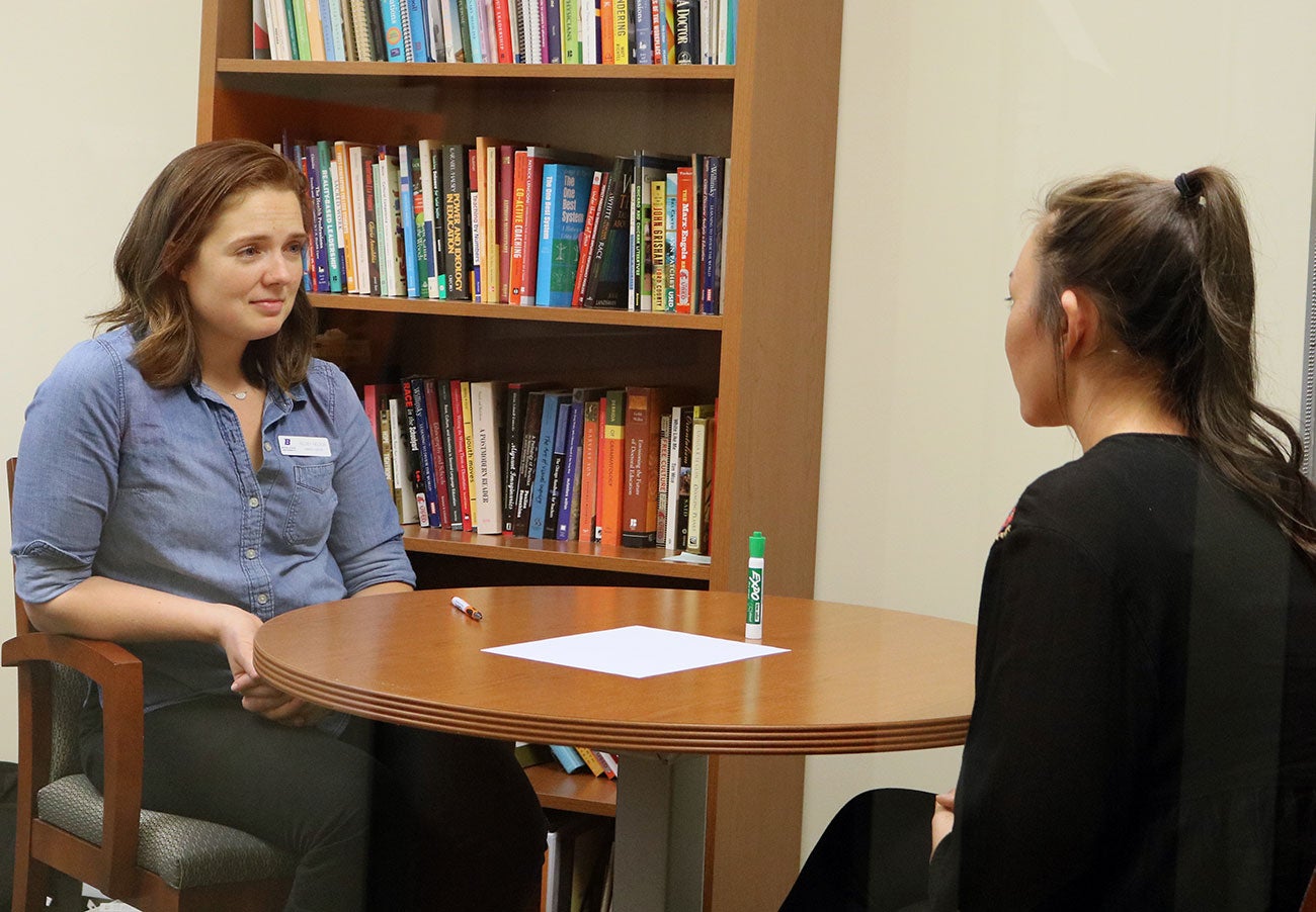 Staff member Kelsey Nelson conducts a mock mini medical interview with a student during a workshop
