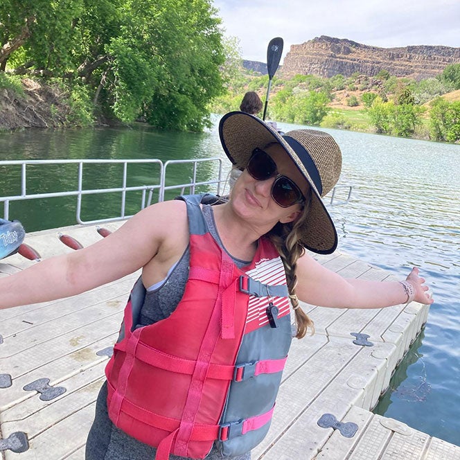 Jessica Gardner poses on dock while kayaking