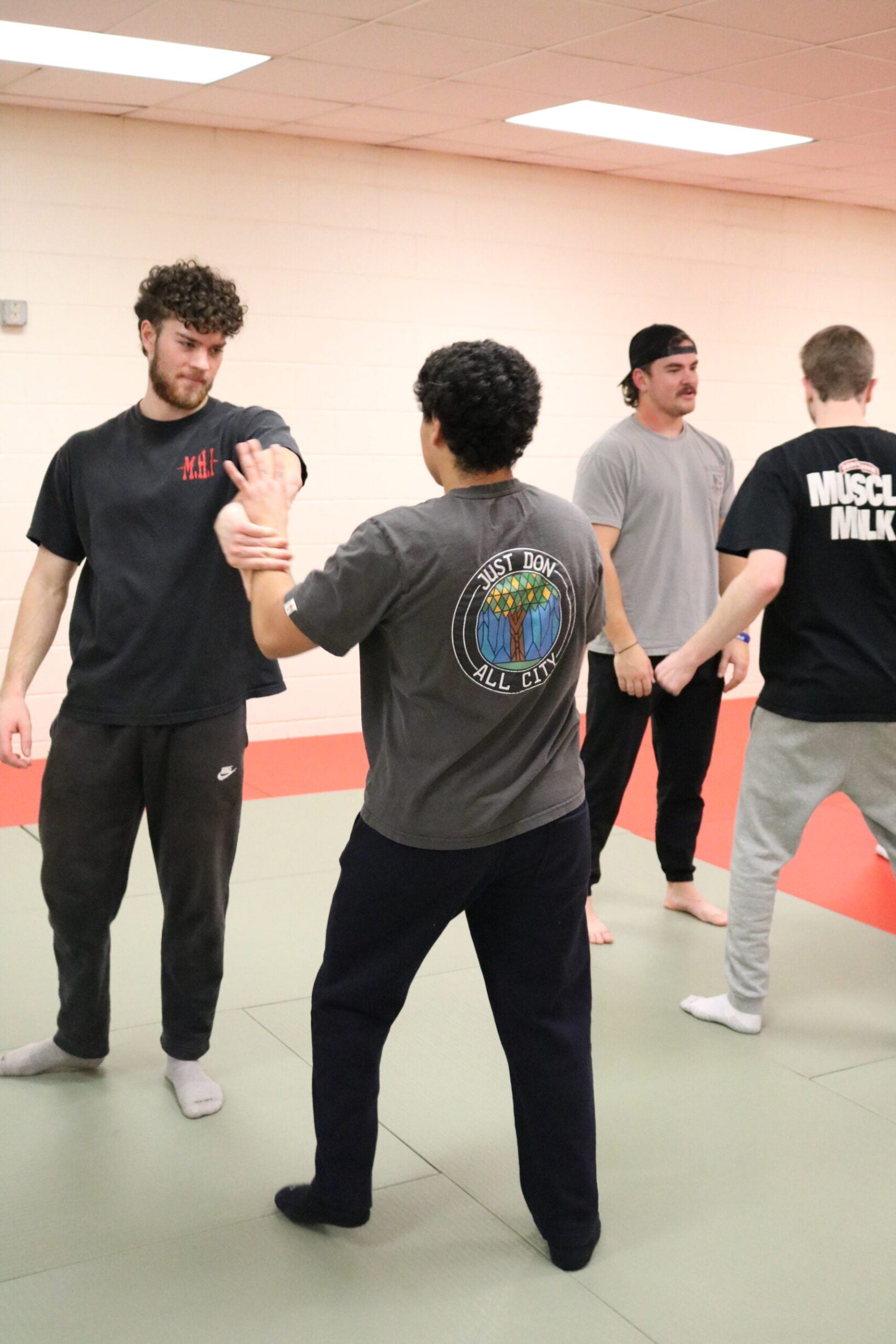 Students take turns escaping wrist holds.