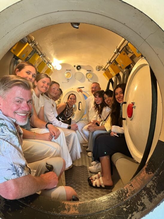 Students and faculty touring the Hyperbaric chamber treatment facility